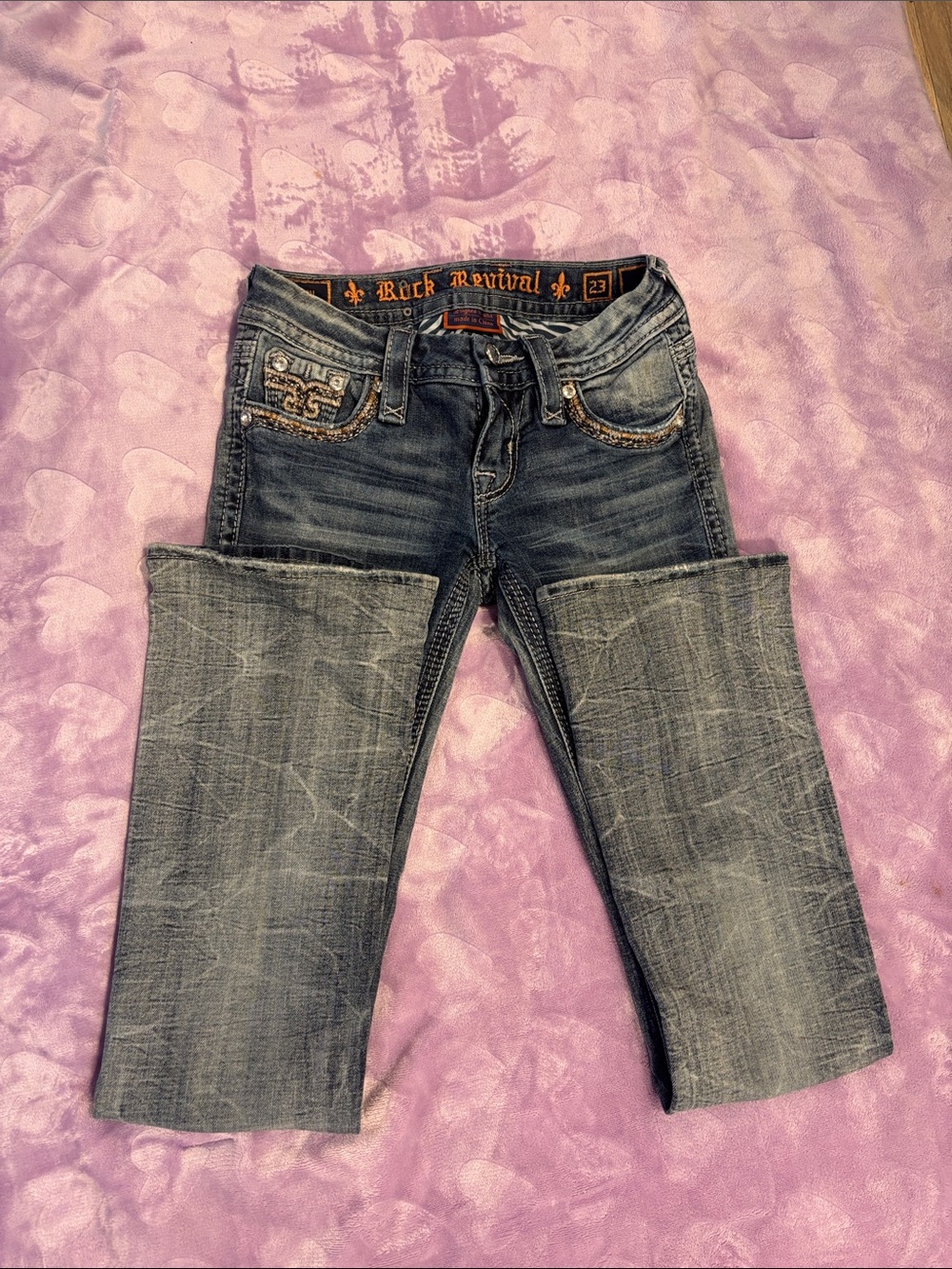 Rock Revival size 23 Betty boot cut style. Faded  Jeans with Embroidered Pockets